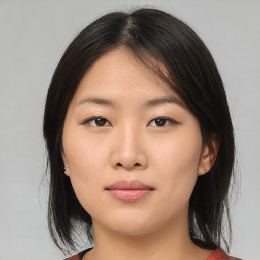 Neutral asian young-adult female with medium  brown hair and brown eyes