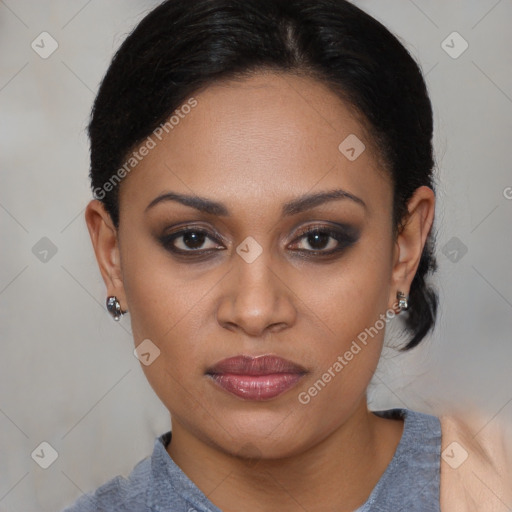 Joyful black young-adult female with short  black hair and brown eyes