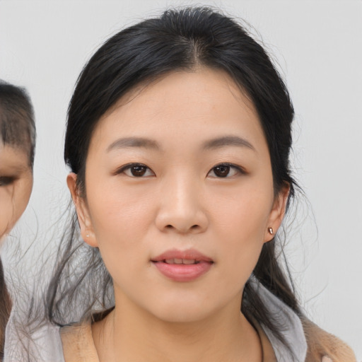 Neutral asian young-adult female with medium  brown hair and brown eyes