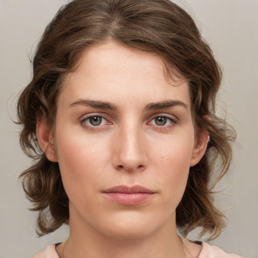 Neutral white young-adult female with medium  brown hair and grey eyes