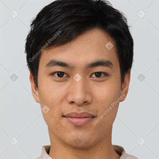 Joyful asian young-adult male with short  brown hair and brown eyes