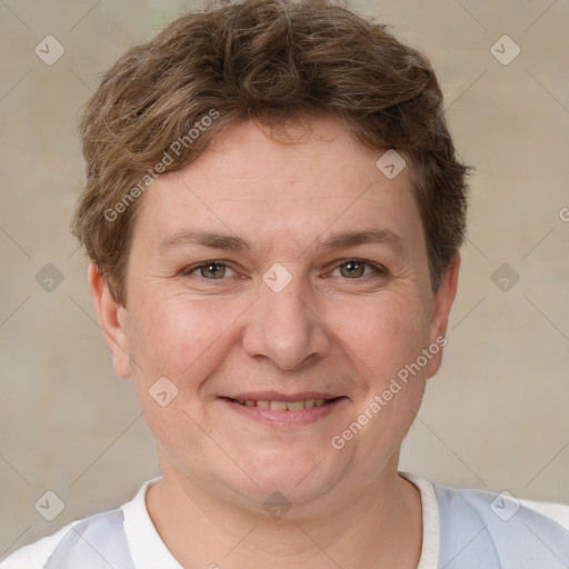 Joyful white adult male with short  brown hair and grey eyes