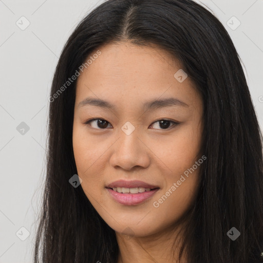 Joyful asian young-adult female with long  brown hair and brown eyes