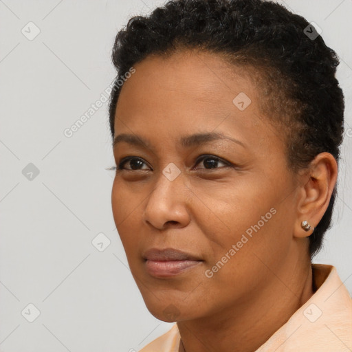 Joyful black adult female with short  brown hair and brown eyes