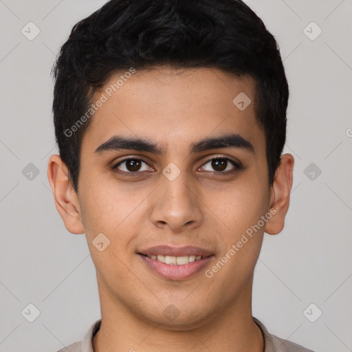 Joyful latino young-adult male with short  black hair and brown eyes