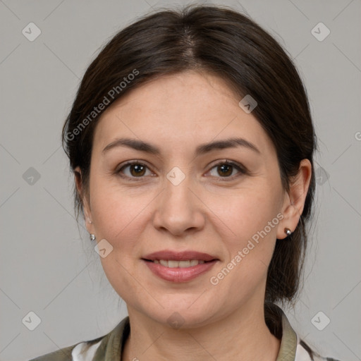 Joyful white adult female with medium  brown hair and grey eyes