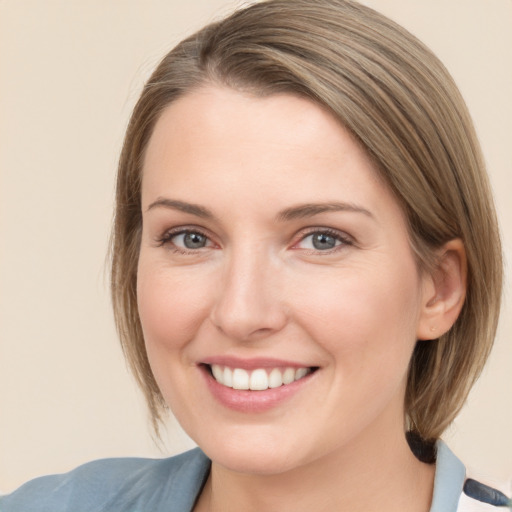 Joyful white young-adult female with medium  brown hair and blue eyes