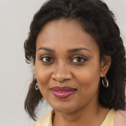 Joyful black young-adult female with medium  brown hair and brown eyes