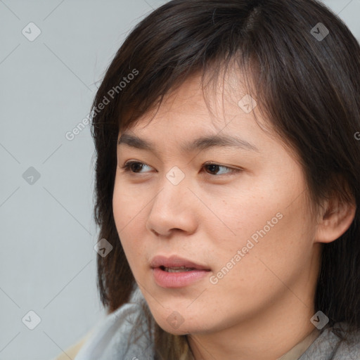 Neutral white young-adult female with medium  brown hair and brown eyes