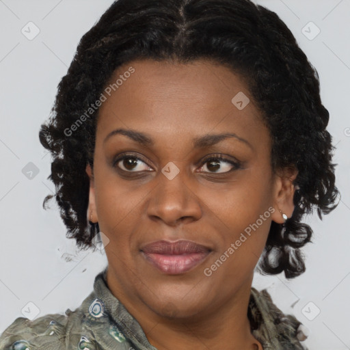 Joyful black young-adult female with medium  brown hair and brown eyes