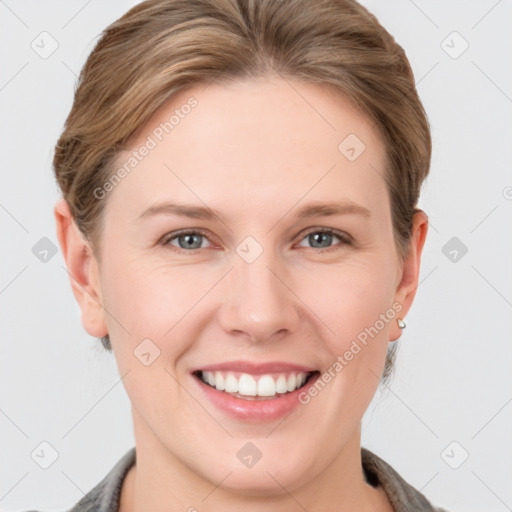 Joyful white young-adult female with short  brown hair and grey eyes