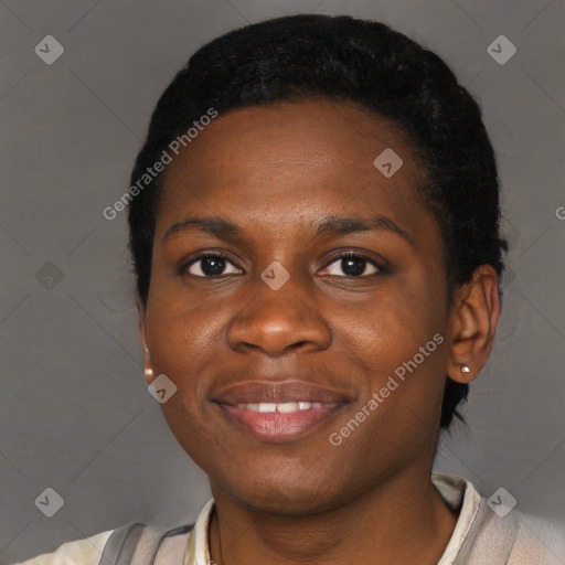 Joyful black young-adult female with short  black hair and brown eyes