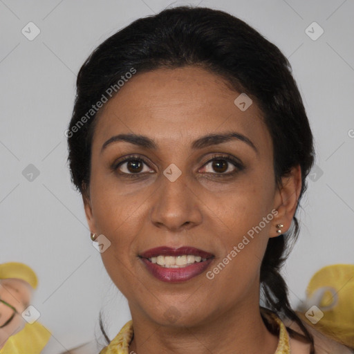 Joyful black adult female with medium  black hair and brown eyes