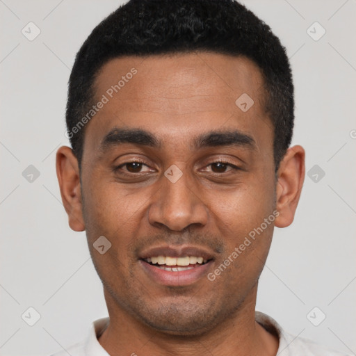 Joyful black young-adult male with short  black hair and brown eyes