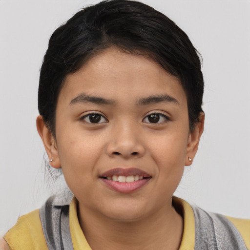 Joyful white child female with short  brown hair and brown eyes