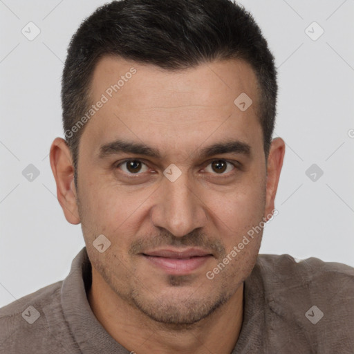 Joyful white adult male with short  brown hair and brown eyes