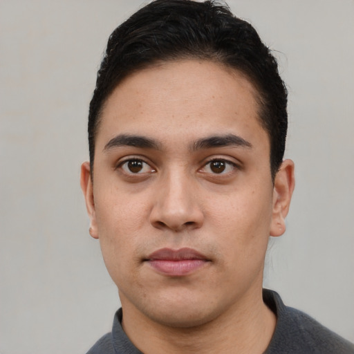 Neutral white young-adult male with short  black hair and brown eyes