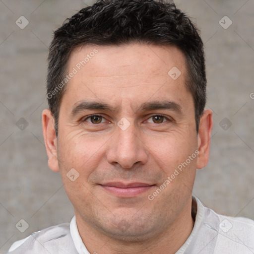 Joyful white adult male with short  brown hair and brown eyes