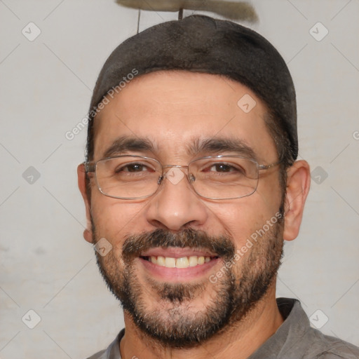 Joyful white adult male with short  black hair and brown eyes