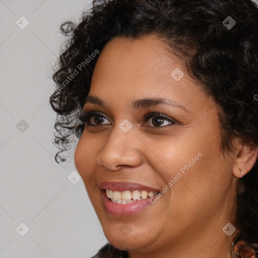 Joyful latino young-adult female with short  brown hair and brown eyes