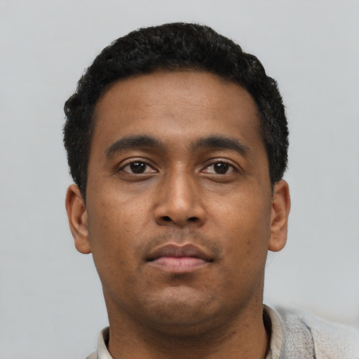 Neutral black young-adult male with short  black hair and brown eyes