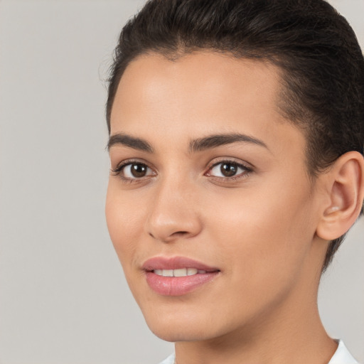 Joyful white young-adult female with short  brown hair and brown eyes