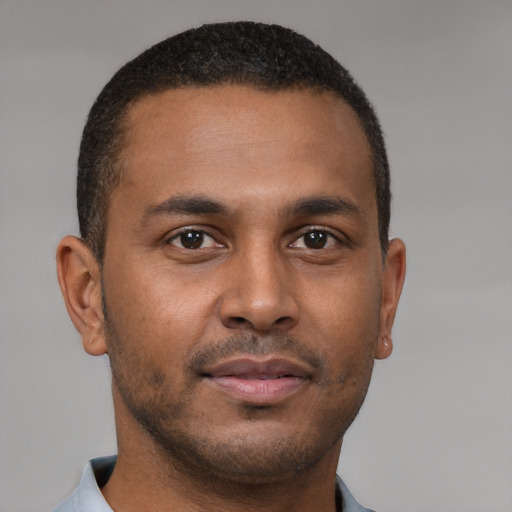 Neutral latino young-adult male with short  brown hair and brown eyes