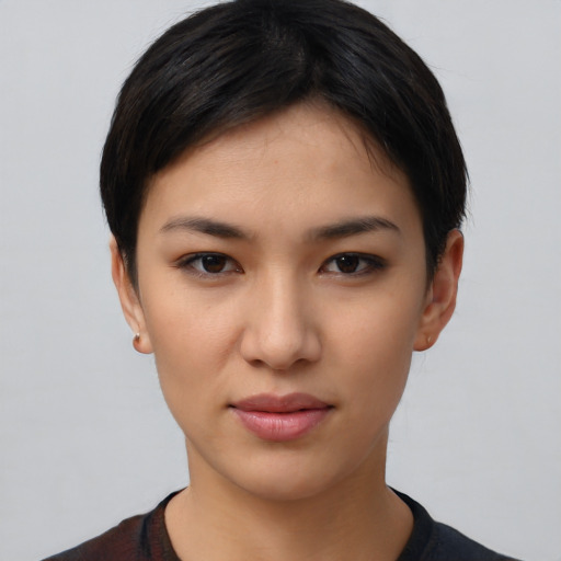 Joyful latino young-adult female with short  black hair and brown eyes