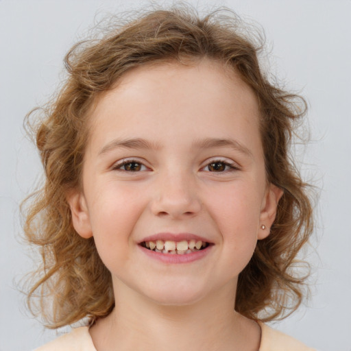 Joyful white child female with medium  brown hair and brown eyes