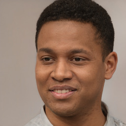 Joyful latino young-adult male with short  brown hair and brown eyes