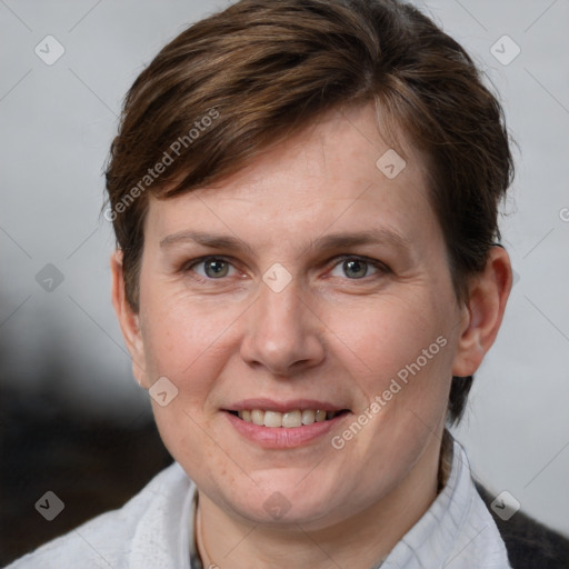 Joyful white adult female with medium  brown hair and grey eyes