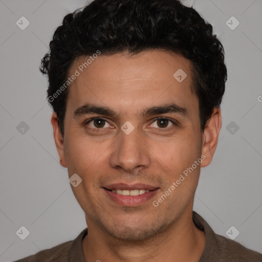 Joyful white young-adult male with short  black hair and brown eyes