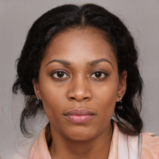 Neutral black young-adult female with medium  brown hair and brown eyes