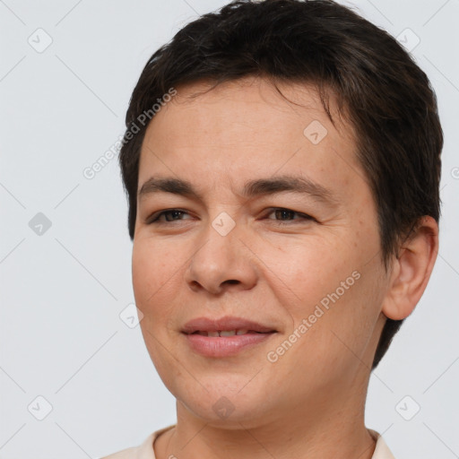 Joyful white adult female with short  brown hair and brown eyes