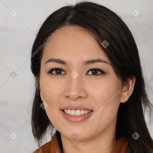 Joyful asian young-adult female with long  brown hair and brown eyes