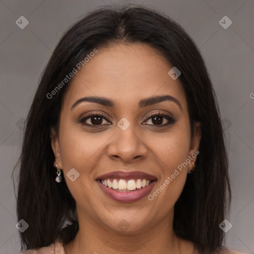 Joyful latino young-adult female with long  brown hair and brown eyes