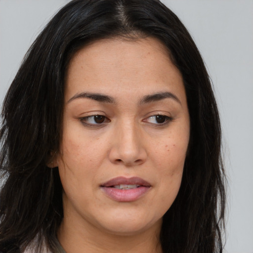 Joyful asian young-adult female with long  brown hair and brown eyes