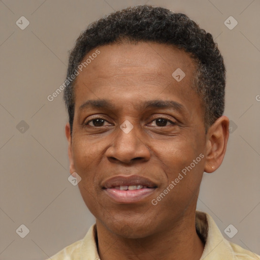 Joyful latino adult male with short  brown hair and brown eyes