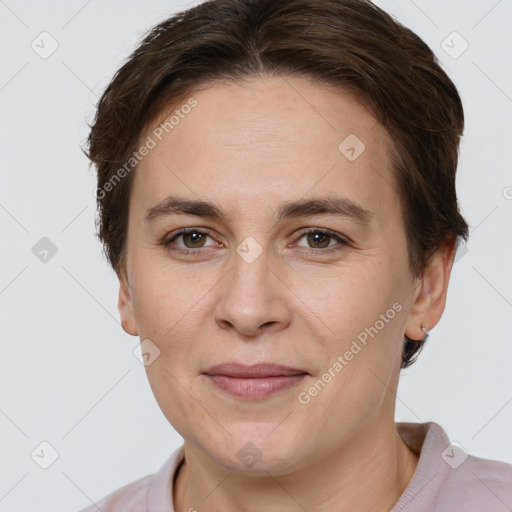 Joyful white adult female with short  brown hair and grey eyes