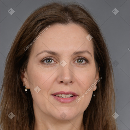 Joyful white adult female with long  brown hair and brown eyes