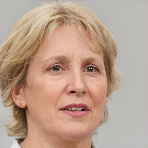 Joyful white middle-aged female with medium  brown hair and blue eyes