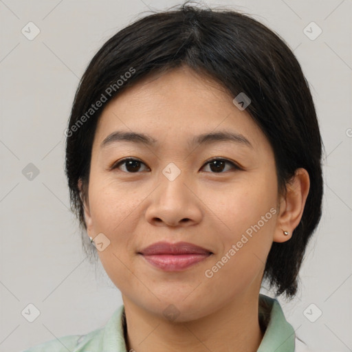 Joyful asian young-adult female with medium  brown hair and brown eyes