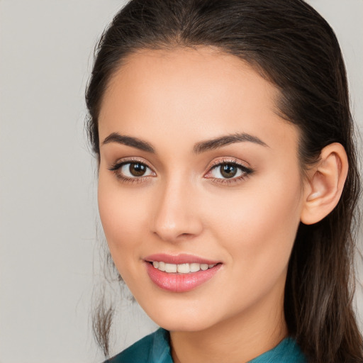 Joyful white young-adult female with long  brown hair and brown eyes