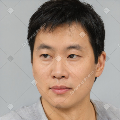 Neutral asian young-adult male with short  brown hair and brown eyes