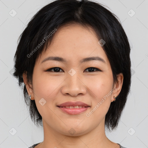 Joyful asian young-adult female with medium  black hair and brown eyes