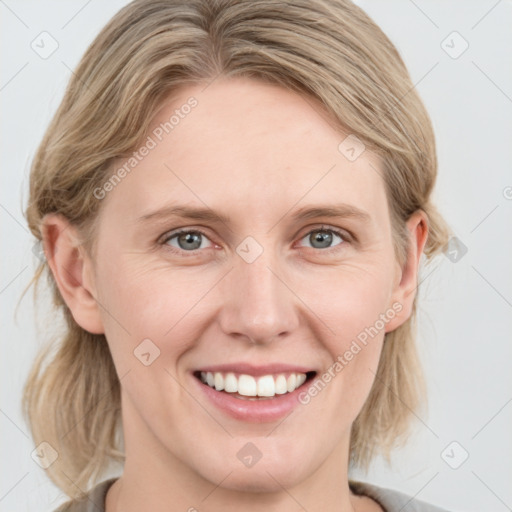 Joyful white young-adult female with medium  brown hair and blue eyes