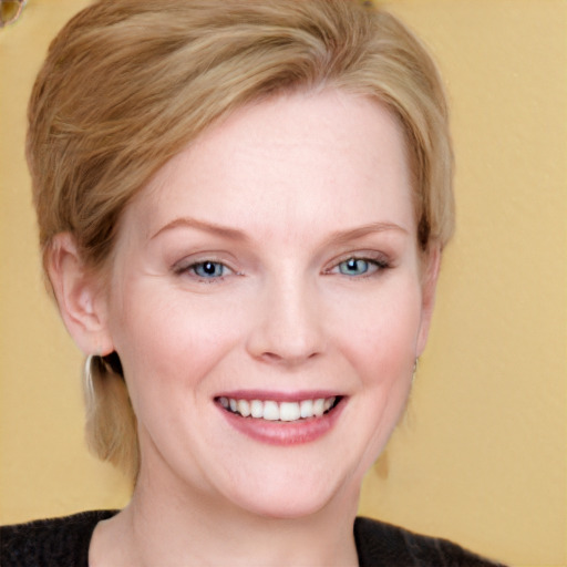 Joyful white young-adult female with medium  brown hair and blue eyes