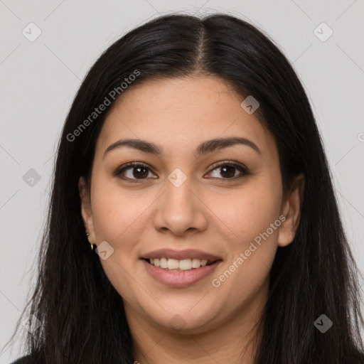 Joyful latino young-adult female with long  brown hair and brown eyes