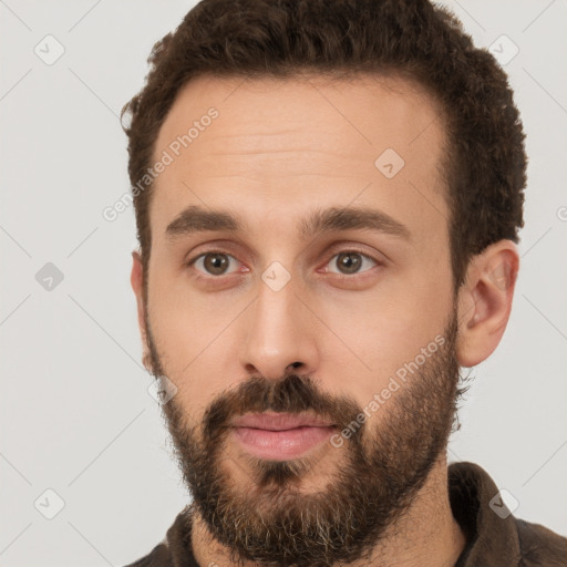 Neutral white young-adult male with short  brown hair and brown eyes