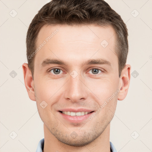 Joyful white young-adult male with short  brown hair and grey eyes